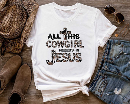 All This Cowgirl Needs Is Jesus Ladies T-Shirt - Premium T-Shirt -  Follower Of Faith Apparel 2 day delivery, Animal print Christian tees, Cotton, Cow hid letters, Cowgirl and Jesus t shirts, Crew neck, DTG, Express delivery, Fast delivery, Ladies Christian t shirts, ladies short sleeve, Ladies short sleeve tee, ladies short sleeve tees, Neck Labels, New, Regular fit, T-shirts, Unisex, Women's Clothing Shop our Christian T-Shirts & Apparel