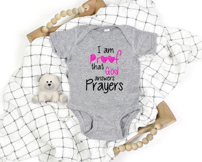 God Answers Prayers Baby Girl Onesie - Premium Kids clothes -  Follower Of Faith ApparelBaby Christian onesie, Baby Clothing, Baby girl onesie, Bodysuits, Christian baby girl apparel, Christian tees for babies, Cotton, Faith baby clothes, Faith based baby clothes, Kids' Clothing, Onesies, Regular fit Shop our Christian T-Shirts & Apparel