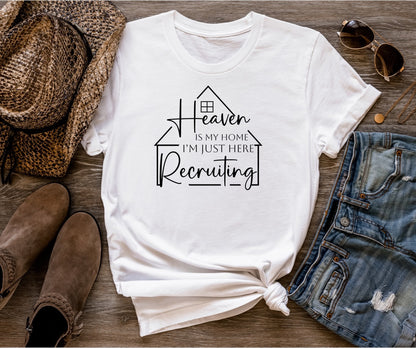 Heaven Is My Home Ladies Short Sleeve Tee - Premium Ladies Short Sleeve T-Shirt -  Follower Of Faith ApparelCotton, Crew neck, heaven is my home I am just here recruiting t-shirt, heaven is my home tee, heaven shirt, Jesus tees for ladies, ladies Christian apparel, ladies Christian t shirts, ladies Christian tees, ladies Short sleeve, Neck Labels, Regular fit, short sleeve ladies Christian shirt, T-shirts, Unisex, Women's Clothing Shop our Christian T-Shirts & Apparel