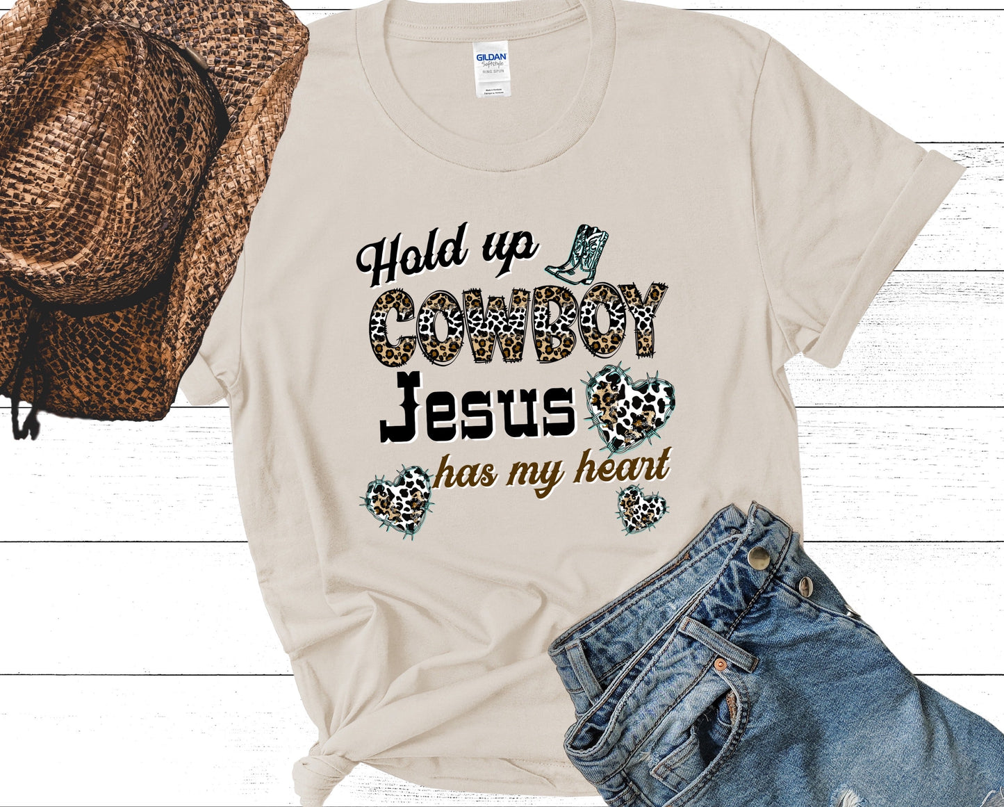 Hold Up Cowboy Jesus Has My Heart Ladies Short Sleeve Tee - Premium T-Shirt -  Follower Of Faith ApparelAnimal print Christian t shirts, Christian apparel and tees, Cotton, Cowgirl and Jesus t shirts, Crew neck, DTG, Hold up Cowboy Jesus has my heart tee, Neck Labels, new, new arrival, Regular fit, T-shirts, Viral Christian t shirt, Women's Clothing Shop our Christian T-Shirts & Apparel