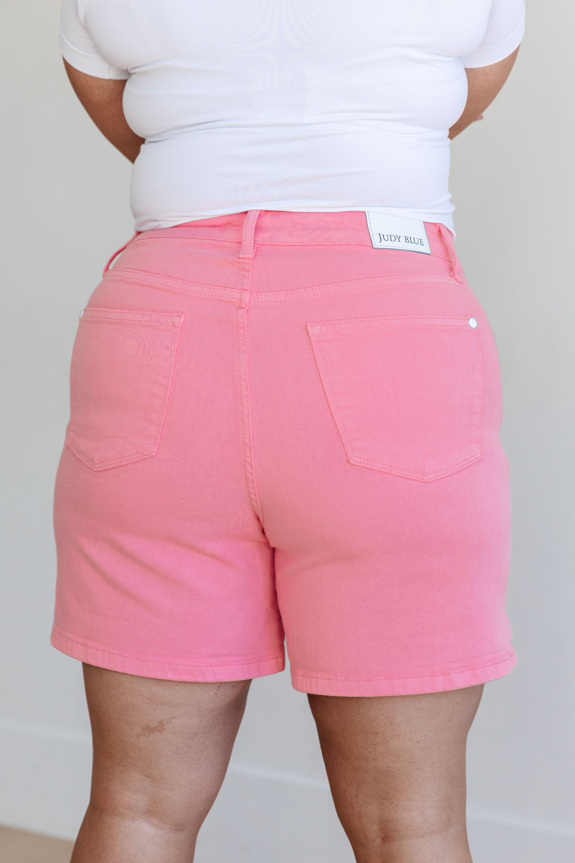 Judy Blue Jenna High Rise Control Top Cuffed Shorts in Pink - Premium Ladies shorts -  Follower Of Faith Apparel 150285, 1XL, 2-21-2024, 2XL, 3-28-2024, 3-6-2024, 3XL, 4-11-2024, 4-4-2024, Bottoms, Control top judy blue shorts, Denim, flatrate, JB Judy Blue, JB2-21-2024, JBAvailableNow, Judy Blue, Judy blue Colored shorts, Judy blue cuff, Judy blue pink shorts, Large, Medium, new, new arrival, new arrivals, Sale, Shorts, Small, Womens pink denim shorts by judy blue, XL Shop our Christian T-Shirts & Apparel