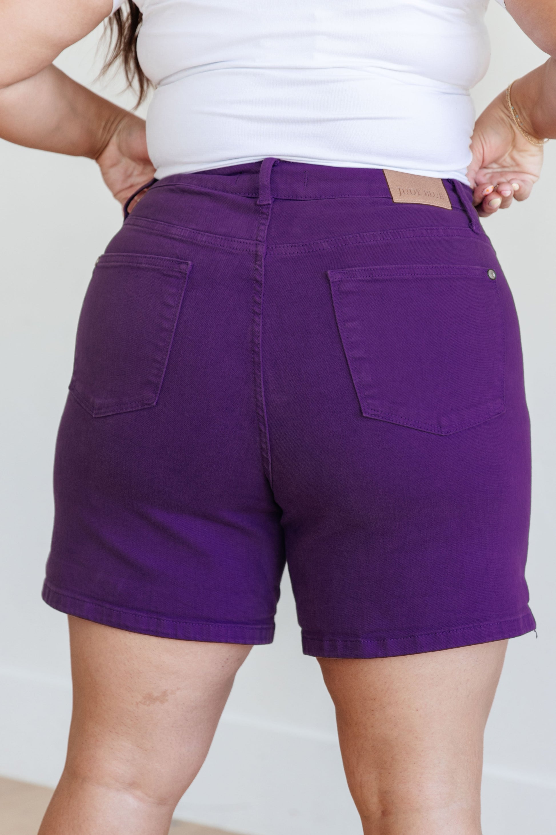 Judy Blue Jenna High Rise Control Top Cuffed Shorts in Purple - Premium Ladies shorts -  Follower Of Faith Apparel150268, 1XL, 2-21-2024, 2XL, 3XL, Bottoms, Control top., Denim, flatrate, JB Judy Blue, JB2-21-2024, JBAvailableNow, Judy Blue, Judy blue colorful shorts, Judy blue control top shorts in purple, Judy blue purple shorts, Judy blue shorts, Judy blue tummy control, Large, Medium, new, new arrival, new arrivals, Sale, Small, stretchy, Stretchy shorts, XL Shop our Christian T-Shirts & Apparel