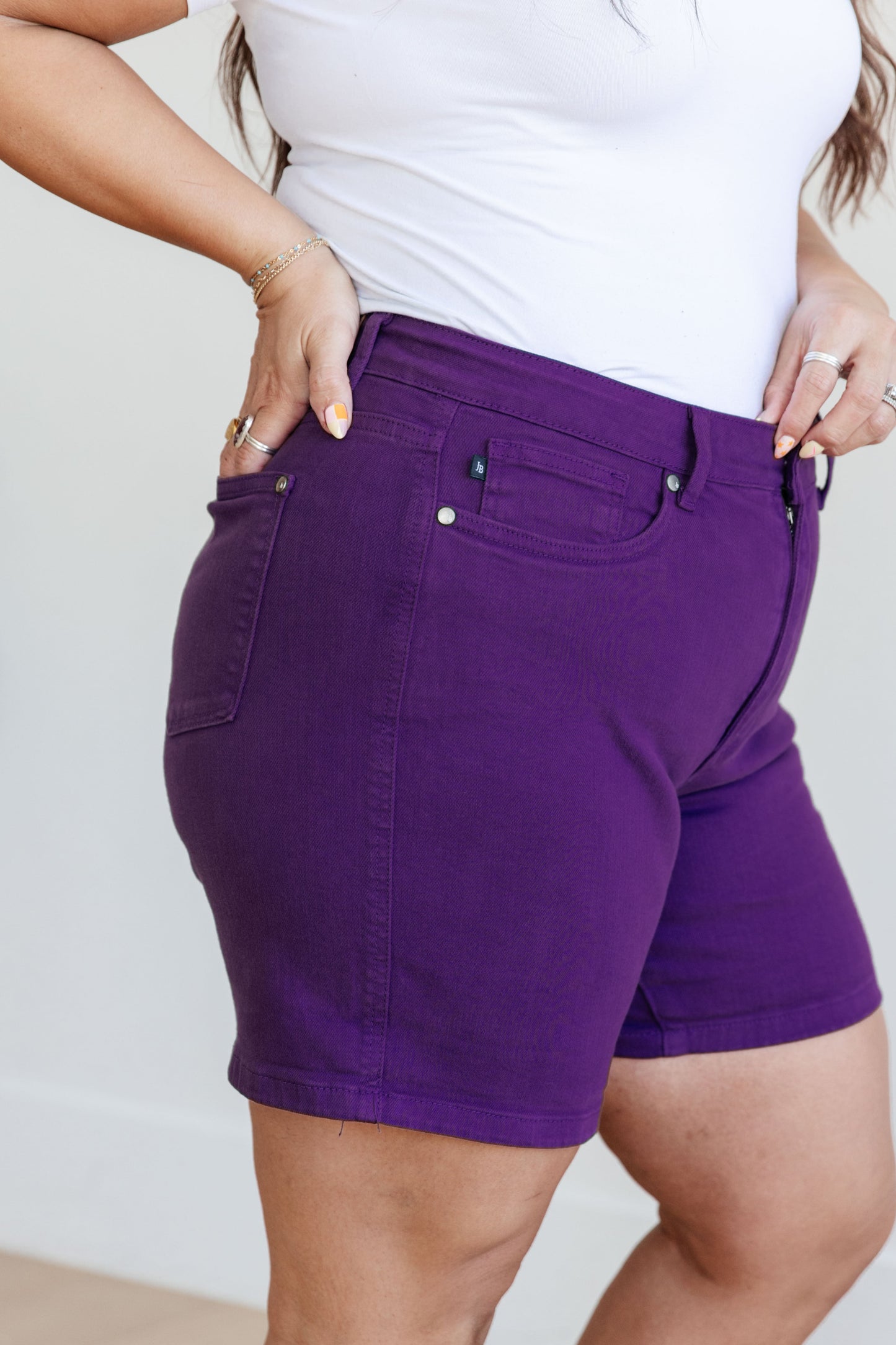 Judy Blue Jenna High Rise Control Top Cuffed Shorts in Purple - Premium Ladies shorts -  Follower Of Faith Apparel150268, 1XL, 2-21-2024, 2XL, 3XL, Bottoms, Control top., Denim, flatrate, JB Judy Blue, JB2-21-2024, JBAvailableNow, Judy Blue, Judy blue colorful shorts, Judy blue control top shorts in purple, Judy blue purple shorts, Judy blue shorts, Judy blue tummy control, Large, Medium, new, new arrival, new arrivals, Sale, Small, stretchy, Stretchy shorts, XL Shop our Christian T-Shirts & Apparel