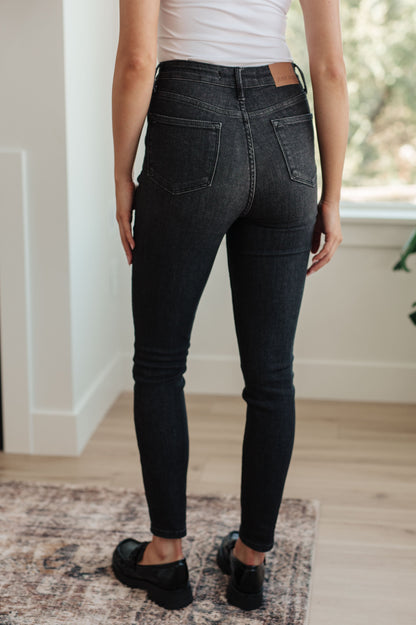 Judy Blue Octavia High Rise Control Top Skinny Jeans in Washed Black - Premium Jeans -  Follower Of Faith Apparel0/24, 1/25, 11-1-2023, 11-13-2023, 11-21-2023, 11/30, 13/31, 14W, 15/32, 16W, 18W, 20W, 22W, 24W, 3/26, 5/27, 7/28, 9/29, ASF12-1-2023, black wash jeans, black washed, Bottoms, Denim, flatrate, Indoor, JB Judy Blue, JB11-1-2023, JB20, JBAvailableNow, Judy Blue, Judy blue high rise jeans, judy blue high waist jeans, Judy Blue Jeans, Kylie, Lifestyle, Sabrina Shop our Christian T-Shirts & Apparel