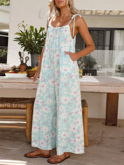 Pastel Floral Wide Leg Jumpsuit with Pockets - Premium Ladies Rompers -  Follower Of Faith Apparel Chic romper, Cozy rompers, Floral Ladies Romper, Ladies Romper, new arrival, new arrivals, romper jumpsuit, Romper pants, Romper pants jumpsuit, Rompers, Sale, Ship From Overseas, Spaghetti Strap Romper, T@D, Vacation rompers, Womens floral jumpsuit romper, Womens floral romper, Women’s romper Shop our Christian T-Shirts & Apparel